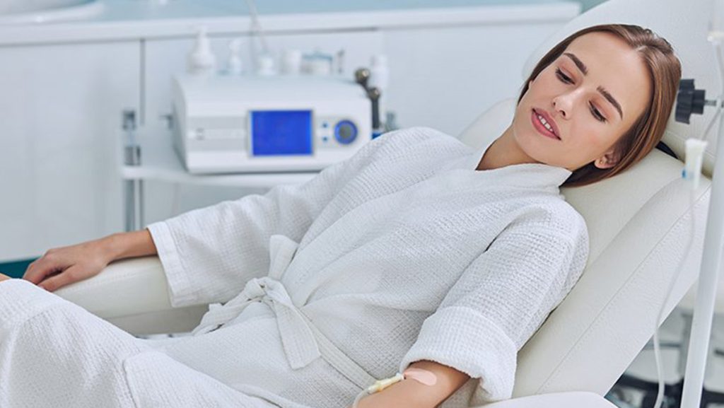 Maximizing Infusion Therapy - woman getting IV Therapy in a professional wellness clinic