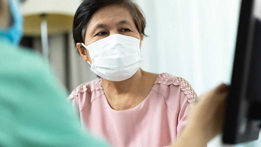 Women’s health screenings and appointments have been reduced dramatically as a result of the COVID-19 pandemic - woman visiting a health care facility